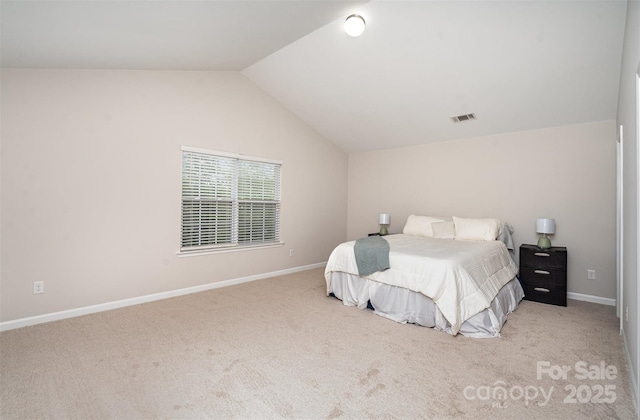 bedroom featuring vaulted ceiling, carpet floors, and baseboards