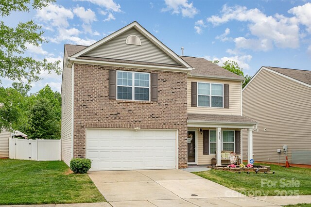 traditional home featuring an attached garage, driveway, brick siding, a porch, and a gate
