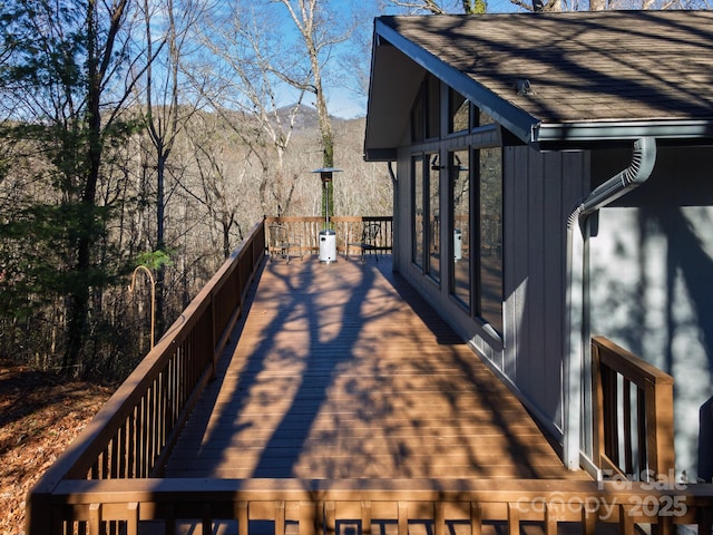 wooden deck featuring a mountain view
