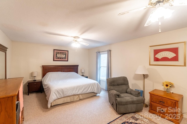 bedroom with light carpet and a ceiling fan