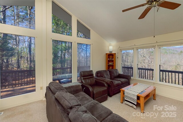 202 Otto Heights Rd, Franklin, NC 28734 - living area with high vaulted ceiling, carpet flooring, a ceiling fan, and baseboards