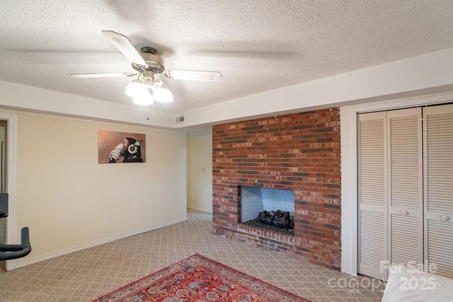 202 Otto Heights Rd, Franklin, NC 28734 - unfurnished living room with a fireplace, carpet flooring, ceiling fan, baseboards, and a textured ceiling
