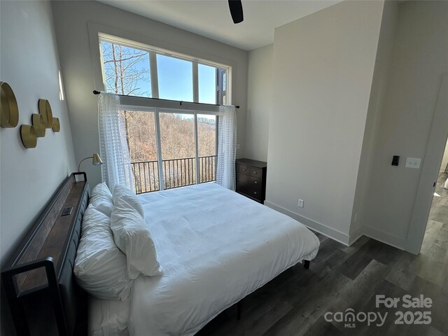 3149 Winter Hawk Ln, Lenoir, NC 28645 - bedroom featuring dark wood-style flooring, baseboards, and a ceiling fan