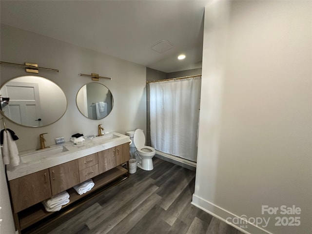 3149 Winter Hawk Ln, Lenoir, NC 28645 - bathroom with toilet, wood finished floors, double vanity, baseboards, and a shower with curtain