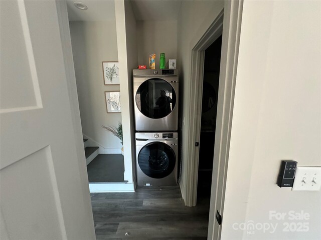 3149 Winter Hawk Ln, Lenoir, NC 28645 - washroom featuring stacked washing machine and dryer and wood finished floors