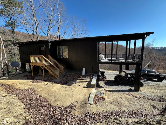 3149 Winter Hawk Ln, Lenoir, NC 28645 - back of house with stairs, board and batten siding, and a deck