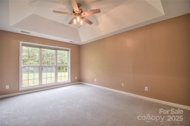 330 Kilmer Ln, Mooresville, NC 28115 - carpeted empty room featuring a raised ceiling, ceiling fan, and baseboards
