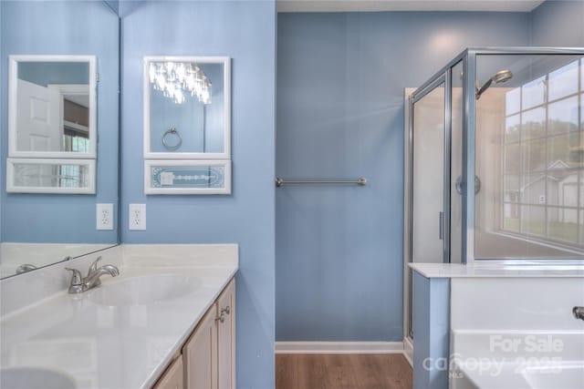 330 Kilmer Ln, Mooresville, NC 28115 - full bath with a stall shower, wood finished floors, double vanity, and baseboards