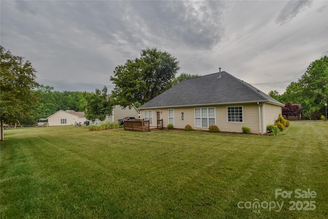 330 Kilmer Ln, Mooresville, NC 28115 - rear view of property featuring a yard, a deck, and a shingled roof