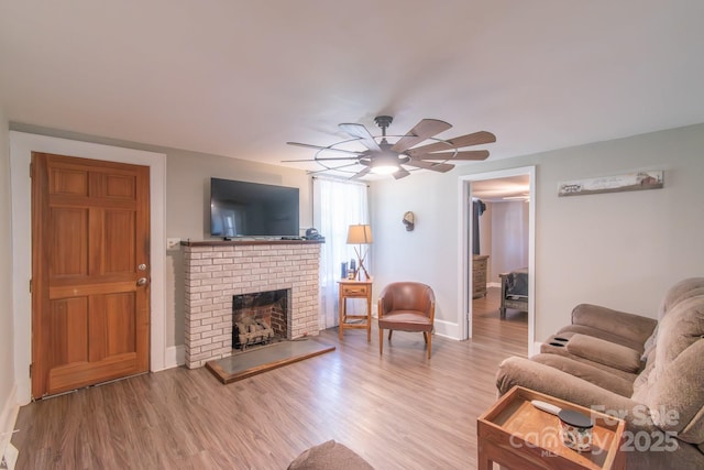 28782 Canton Rd Unit A, Albemarle, NC 28001 - living area with ceiling fan, light wood-style floors, baseboards, and a fireplace