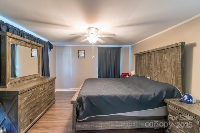 28782 Canton Rd Unit A, Albemarle, NC 28001 - bedroom featuring wood finished floors, ornamental molding, baseboards, and a ceiling fan