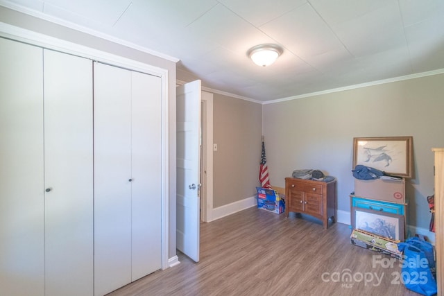 28782 Canton Rd Unit A, Albemarle, NC 28001 - unfurnished bedroom with wood finished floors, baseboards, ornamental molding, and a closet