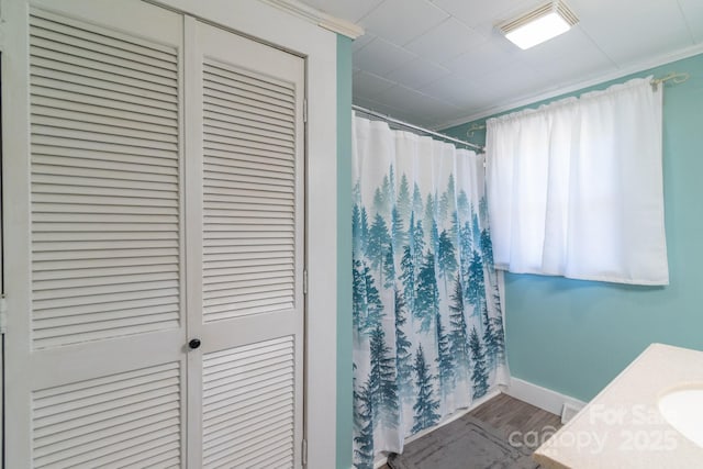 28782 Canton Rd Unit A, Albemarle, NC 28001 - full bathroom featuring wood finished floors, a closet, curtained shower, baseboards, and vanity