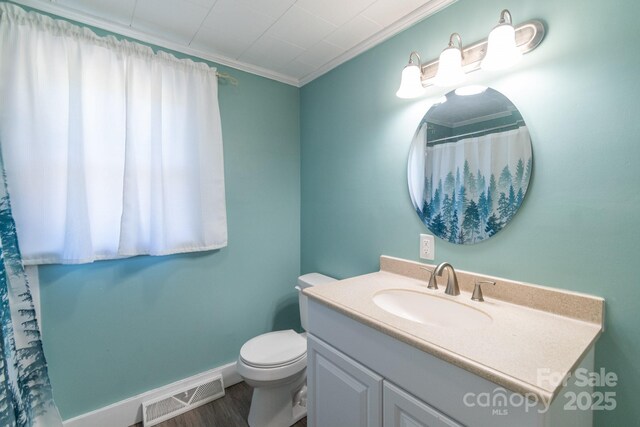 28782 Canton Rd Unit A, Albemarle, NC 28001 - bathroom with toilet, vanity, wood finished floors, ornamental molding, and baseboards