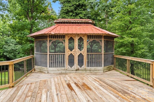 603 Sunnybrook Dr, Monroe, NC 28110 - wooden deck featuring a sunroom