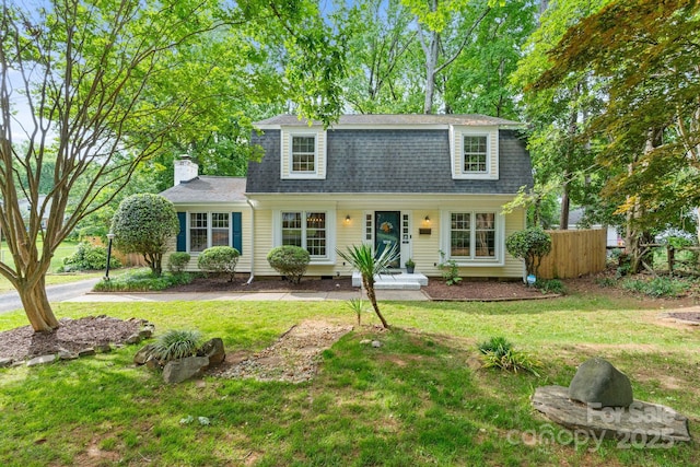 1014 Vandalia Dr, Charlotte, NC 28212 - dutch colonial featuring a chimney and roof with shingles