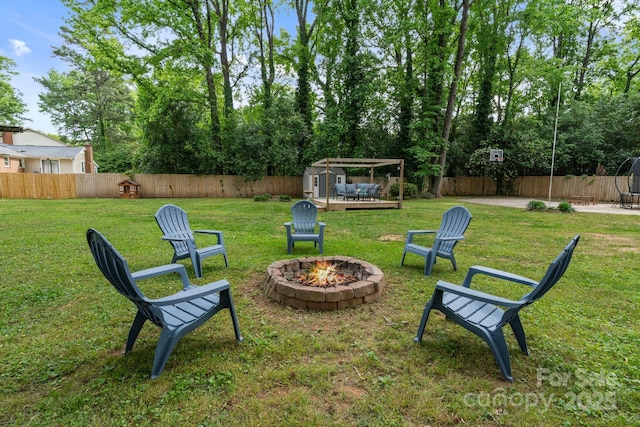 1014 Vandalia Dr, Charlotte, NC 28212 - view of yard with an outdoor fire pit, a storage unit, and an outdoor structure
