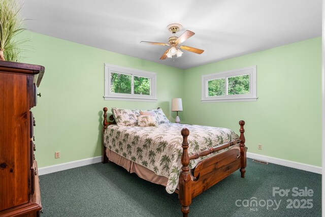 carpeted bedroom with baseboards and a ceiling fan