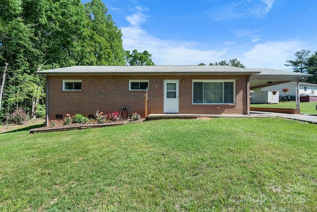 single story home with a carport, a front lawn, and brick siding