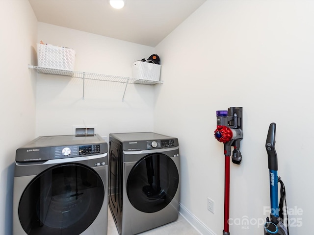 2141 Bexar Trl, Matthews, NC 28105 - laundry room with washing machine and dryer, baseboards, and light tile patterned floors