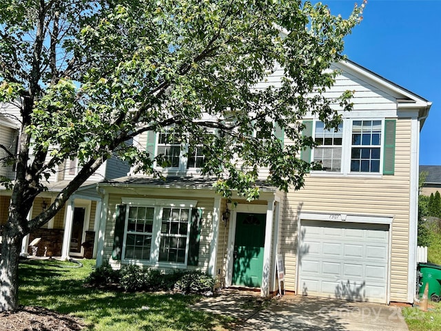 7307 Mitzi Deborah Ln, Charlotte, NC 28269 - view of front facade featuring a garage, concrete driveway, and a front lawn