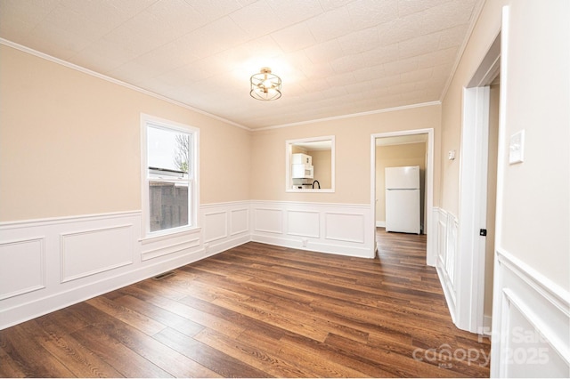 210 W 15th St, Newton, NC 28658 - unfurnished room with ornamental molding, dark wood-style flooring, and wainscoting