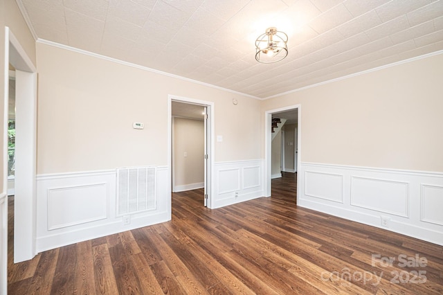 210 W 15th St, Newton, NC 28658 - unfurnished room featuring ornamental molding, dark wood-style flooring, and wainscoting