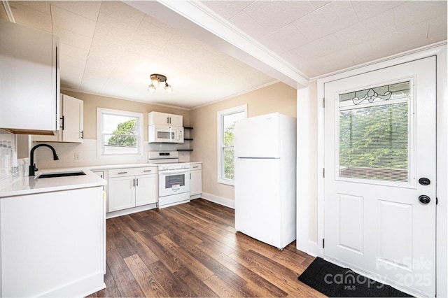 210 W 15th St, Newton, NC 28658 - kitchen with white appliances, a sink, ornamental molding, dark wood finished floors, and backsplash