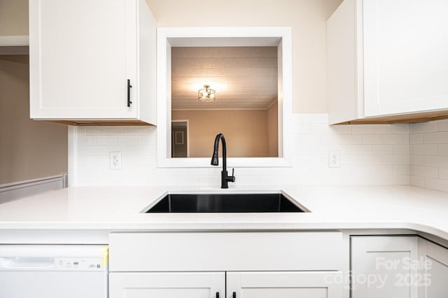 210 W 15th St, Newton, NC 28658 - kitchen with a sink, dishwasher, white cabinetry, light countertops, and tasteful backsplash