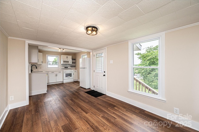 210 W 15th St, Newton, NC 28658 - kitchen with white appliances, dark wood-type flooring, light countertops, ornamental molding, and white cabinets