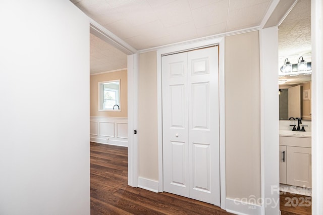 210 W 15th St, Newton, NC 28658 - hallway with crown molding, dark wood-type flooring, and a sink