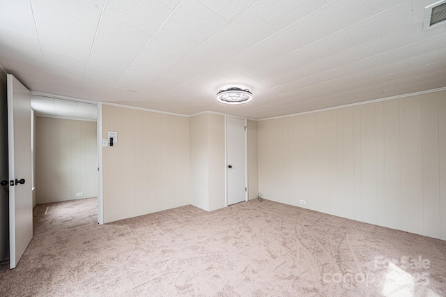 210 W 15th St, Newton, NC 28658 - carpeted empty room featuring crown molding and wooden walls