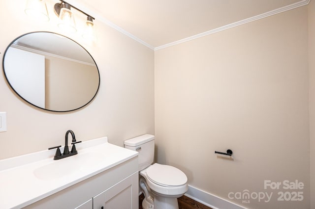 210 W 15th St, Newton, NC 28658 - bathroom with vanity, toilet, crown molding, wood finished floors, and baseboards