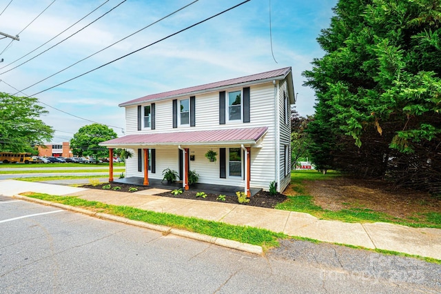 210 W 15th St, Newton, NC 28658 - view of front facade with metal roof, a porch, and uncovered parking