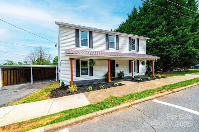 210 W 15th St, Newton, NC 28658 - view of front facade with a porch, metal roof, and driveway