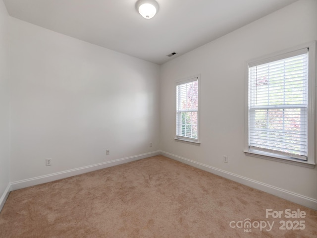 533 Montgrove Pl NW, Concord, NC 28027 - unfurnished room with baseboards and light colored carpet