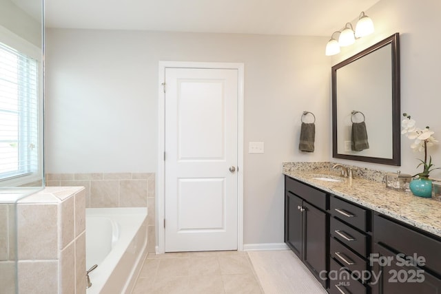 full bathroom featuring tile patterned flooring, vanity, and a bath