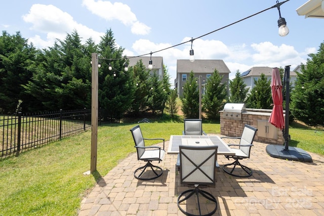 view of patio / terrace featuring area for grilling and outdoor dining space