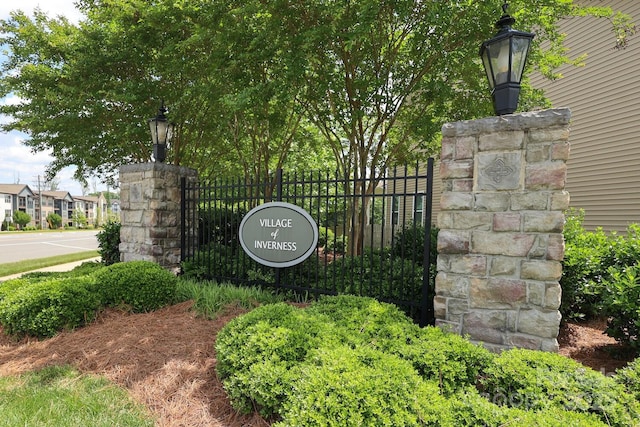community sign with fence