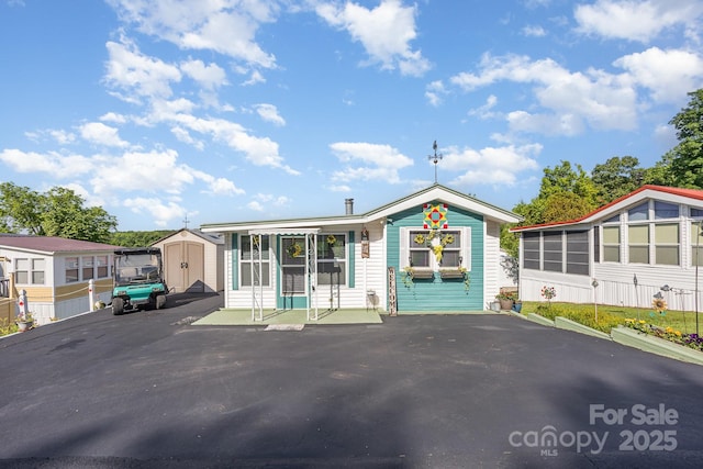 125 Maple St, New London, NC 28127 - view of front of property featuring a sunroom