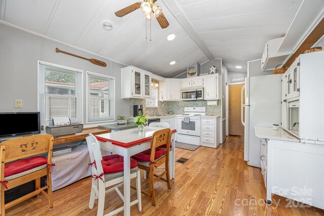 125 Maple St, New London, NC 28127 - kitchen featuring white appliances, light wood-type flooring, ceiling fan, glass insert cabinets, and recessed lighting