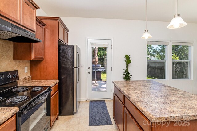 12792 Clydesdale Dr, Midland, NC 28107 - kitchen with black range with electric cooktop, freestanding refrigerator, brown cabinets, and under cabinet range hood