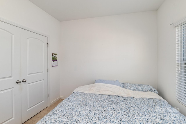 12792 Clydesdale Dr, Midland, NC 28107 - bedroom with light carpet, a closet, and baseboards