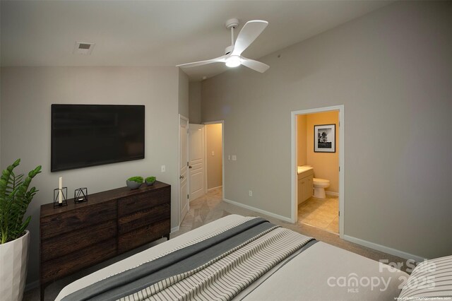 4938 Sunset Ridge Ct, Charlotte, NC 28269 - bedroom featuring light carpet, baseboards, connected bathroom, and ceiling fan