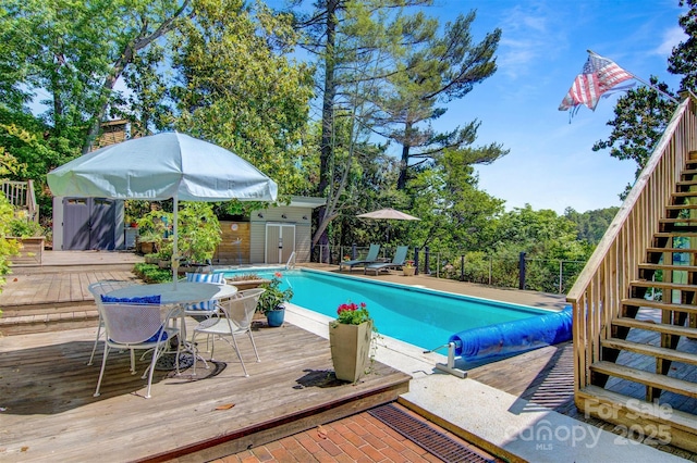 6664 Lake Shore Dr, Hickory, NC 28601 - view of pool with stairs, a wooden deck, and outdoor dining area