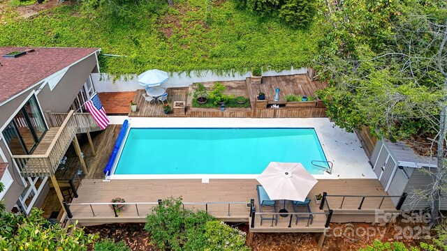6664 Lake Shore Dr, Hickory, NC 28601 - view of pool featuring a wooden deck, a fenced backyard, and outdoor dining space