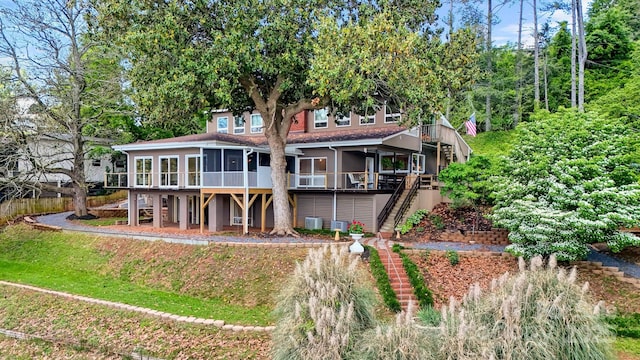 6664 Lake Shore Dr, Hickory, NC 28601 - back of property with stairway, a sunroom, central AC, and a deck