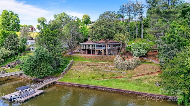 6664 Lake Shore Dr, Hickory, NC 28601 - rear view of house featuring a deck with water view, view of scattered trees, and a lawn