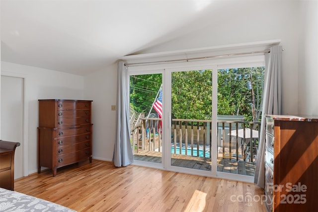 6664 Lake Shore Dr, Hickory, NC 28601 - unfurnished bedroom with lofted ceiling, access to outside, and wood finished floors