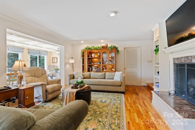 6664 Lake Shore Dr, Hickory, NC 28601 - living room featuring a premium fireplace, light wood-style floors, and recessed lighting